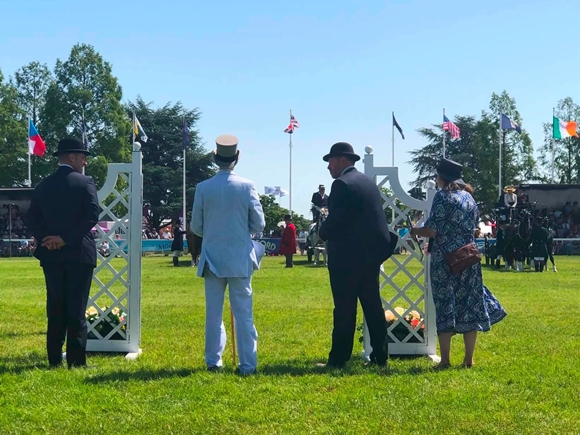 Judge Matt Powers, sponsor Ivan Fisher, and stewards James the farmer and Ellie Cowles
